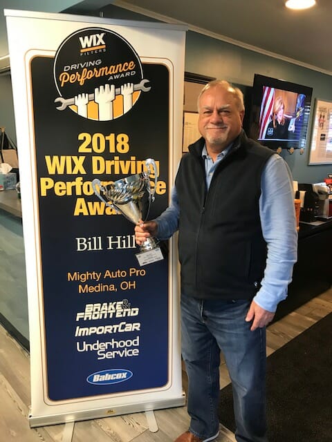 Bill Hill, the owner of Mighty Auto Pro, accepting the WIX performance award in 2018